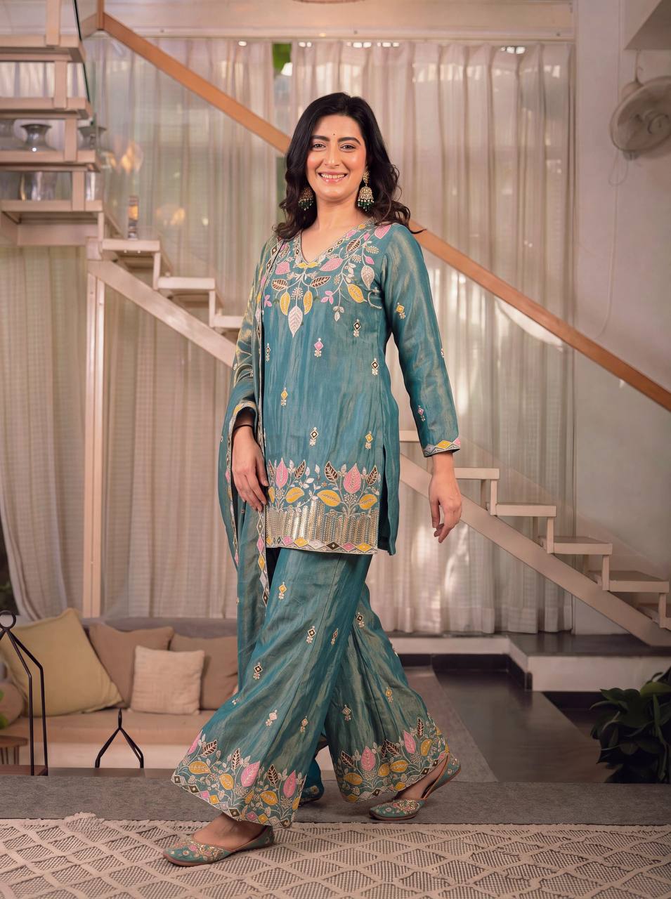 Elegant Rust Orange Silk Kurta and Flared Palazzo Set Adorned with Intricate Multicolored Botanical Embroidery and Mirror Work